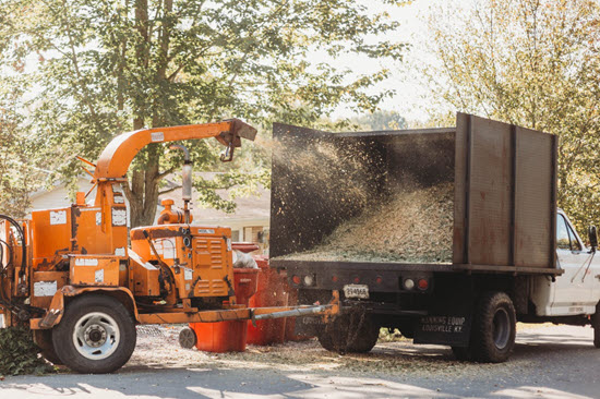 Wood chipper loaded on service truck